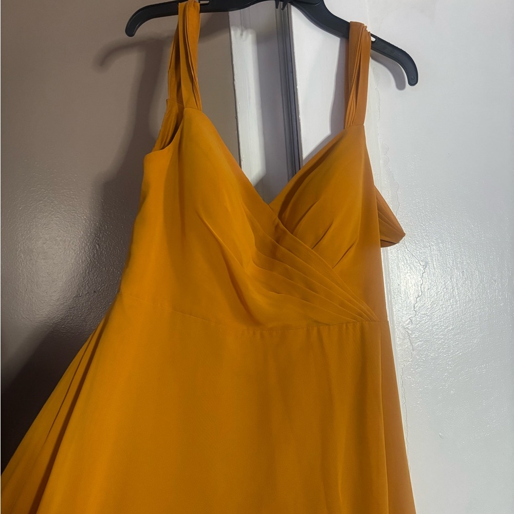 Azazie Cross-Back Halter Dress in mustard yellow